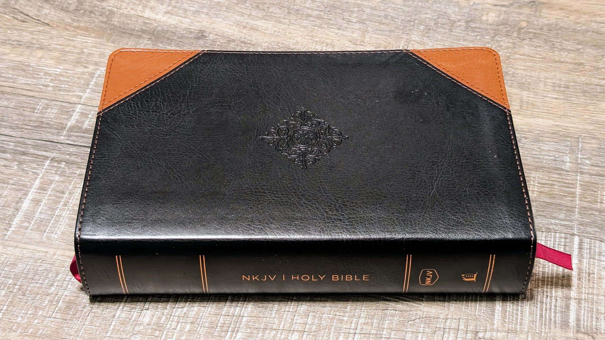 Side view of Bible laying on table